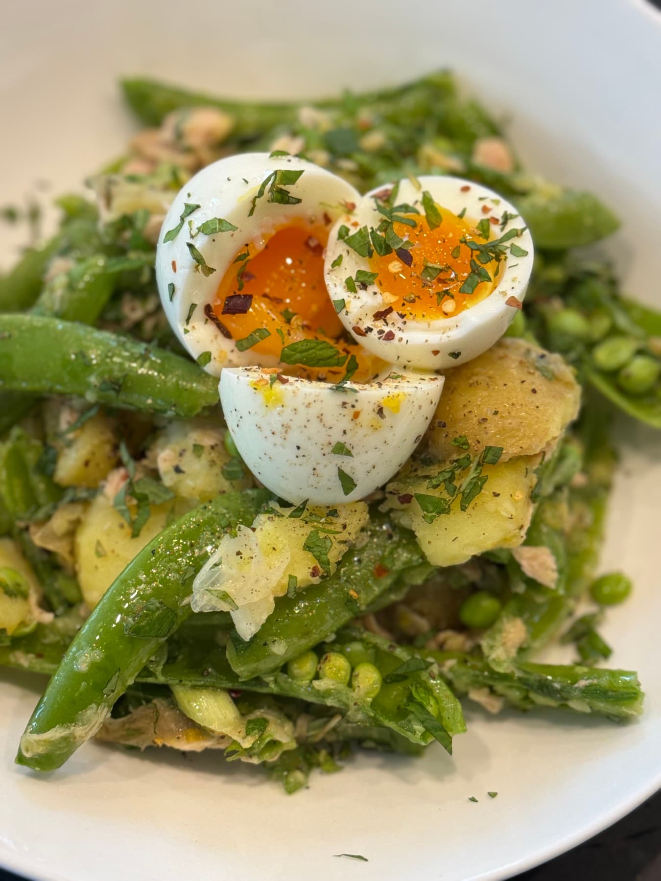 Spring salad with jammy eggs, snap peas, and new potatoes